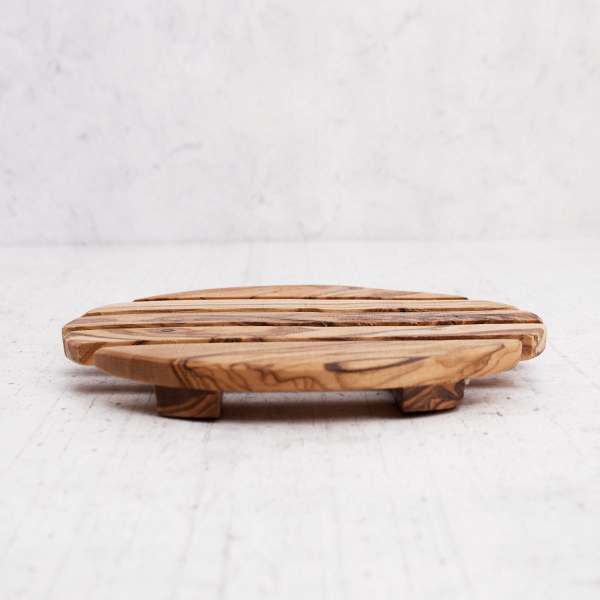 Sotto pentola rotondo in legno di olivo