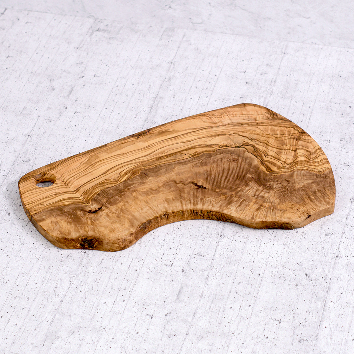 Tagliere irregolare rustico in legno di olivo